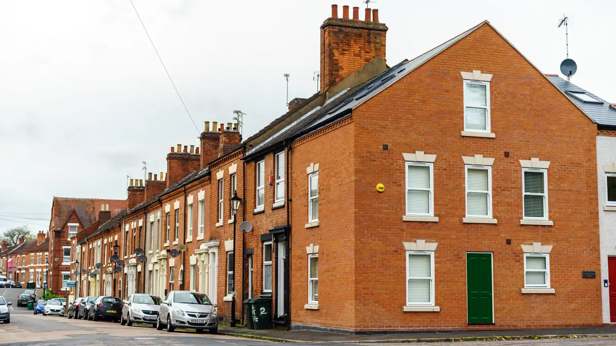 A street of red-brick terraced houses